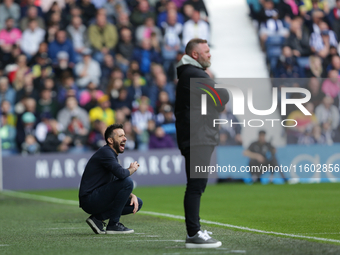 West Bromwich Albion's manager Carlos Corberan kneels during the Sky Bet Championship match between West Bromwich Albion and Plymouth Argyle...