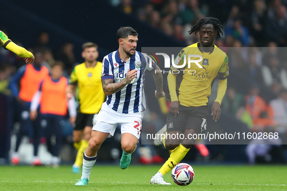 Alex Mowatt of West Bromwich Albion in action with Darko Gyabi of Plymouth Argyle during the Sky Bet Championship match between West Bromwic...