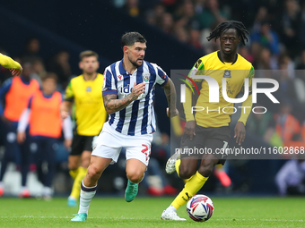 Alex Mowatt of West Bromwich Albion in action with Darko Gyabi of Plymouth Argyle during the Sky Bet Championship match between West Bromwic...