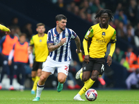 Alex Mowatt of West Bromwich Albion in action with Darko Gyabi of Plymouth Argyle during the Sky Bet Championship match between West Bromwic...