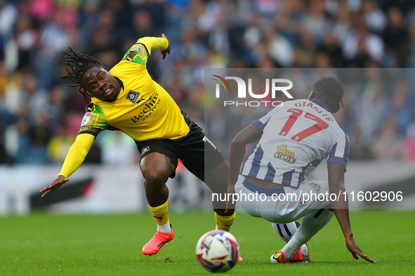 Michael Obafemi of Plymouth Argyle is in action with West Bromwich Albion's Ousmane Diakite during the Sky Bet Championship match between We...