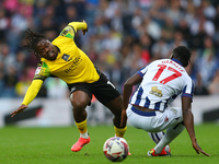 Michael Obafemi of Plymouth Argyle is in action with West Bromwich Albion's Ousmane Diakite during the Sky Bet Championship match between We...