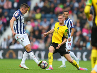 Jed Wallace of West Bromwich (L) in action with Kornel Szucs of Plymouth Argyle during the Sky Bet Championship match between West Bromwich...