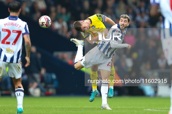 Joe Edwards of Plymouth Argyle challenges for a header with Mikey Johnston of West Bromwich Albion during the Sky Bet Championship match bet...