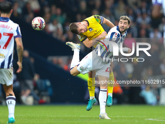 Joe Edwards of Plymouth Argyle challenges for a header with Mikey Johnston of West Bromwich Albion during the Sky Bet Championship match bet...