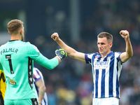 Jed Wallace of West Bromwich Albion celebrates with Alex Palmer after the Sky Bet Championship match between West Bromwich Albion and Plymou...