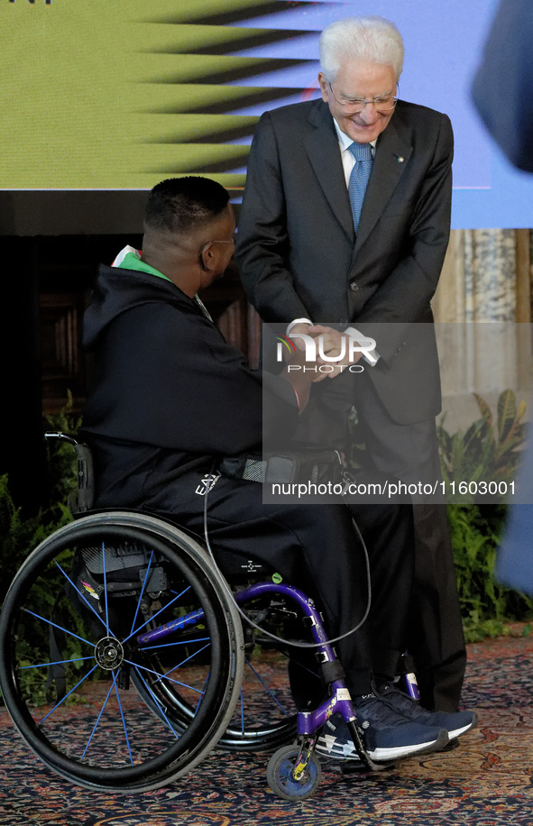 Rigivan Ganeshamoorthy and Sergio Mattarella participate in the return ceremony of the Flag of the Italian athletes returning from the Paris...