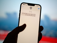 A text message in Arabic calling on people to leave areas risking strikes by the Israel Defence Forces (IDF) is seen on a phone in this illu...