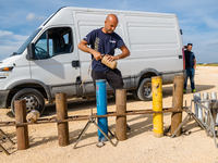 A technician inserts the bombs into the mortar for the preparation of the fireworks display at the New Port under construction in Molfetta,...