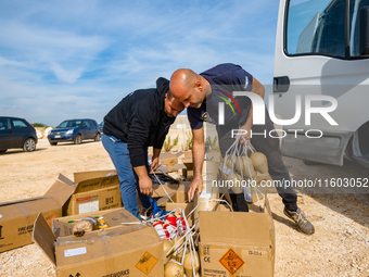 Technicians prepare the fireworks display at the New Port under construction in Molfetta, Italy, on September 22, 2024. On the final day of...