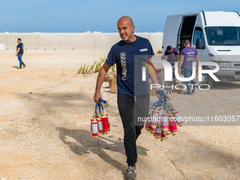 For the preparation of the fireworks display on the New Port under construction in Molfetta, Italy, on September 22, 2024, three fireworks d...