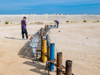 Technicians prepare the fireworks display at the New Port under construction in Molfetta, Italy, on September 22, 2024. On the final day of...