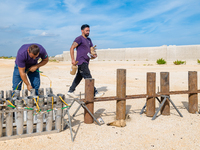 Technicians prepare the fireworks display at the New Port under construction in Molfetta, Italy, on September 22, 2024. On the final day of...