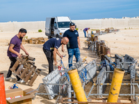 Technicians prepare the fireworks display at the New Port under construction in Molfetta, Italy, on September 22, 2024. On the final day of...