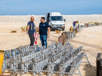 Technicians prepare the fireworks display at the New Port under construction in Molfetta, Italy, on September 22, 2024. On the final day of...