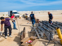 Technicians prepare the fireworks display at the New Port under construction in Molfetta, Italy, on September 22, 2024. On the final day of...