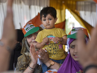 Supporters of the Indian National Congress attend a campaign rally held by Rahul Gandhi in Srinagar, Indian Administered Kashmir, on Septemb...