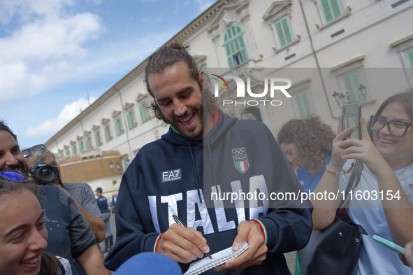 Gianmarco Tamberi signs autographs at the end of the flag ceremony with the President of the Republic Sergio Mattarella in Rome, Italy, on S...