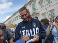 Gianmarco Tamberi signs autographs at the end of the flag ceremony with the President of the Republic Sergio Mattarella in Rome, Italy, on S...