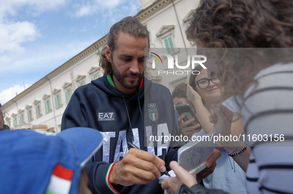 Gianmarco Tamberi signs autographs at the end of the flag ceremony with the President of the Republic Sergio Mattarella in Rome, Italy, on S...