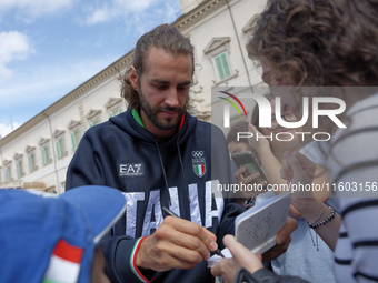 Gianmarco Tamberi signs autographs at the end of the flag ceremony with the President of the Republic Sergio Mattarella in Rome, Italy, on S...