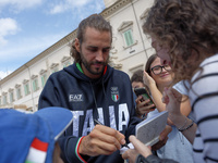 Gianmarco Tamberi signs autographs at the end of the flag ceremony with the President of the Republic Sergio Mattarella in Rome, Italy, on S...