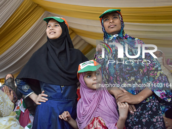 Supporters of the Indian National Congress attend a campaign rally held by Rahul Gandhi in Srinagar, Indian Administered Kashmir, on Septemb...