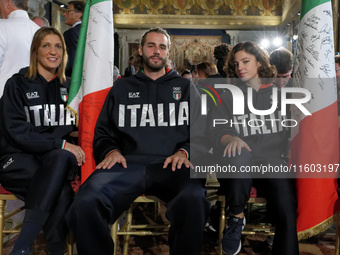 (Left to right) Arianna Arrigo, Gianmarco Tamberi, and Ambra Sabatini during the return ceremony of the flag of the Italian athletes returni...