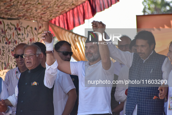 Indian National Congress members stand during a rally held by Rahul Gandhi in Srinagar, Indian Administered Kashmir, on September 23, 2024. 