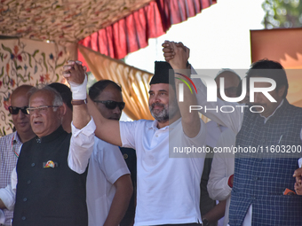 Indian National Congress members stand during a rally held by Rahul Gandhi in Srinagar, Indian Administered Kashmir, on September 23, 2024....