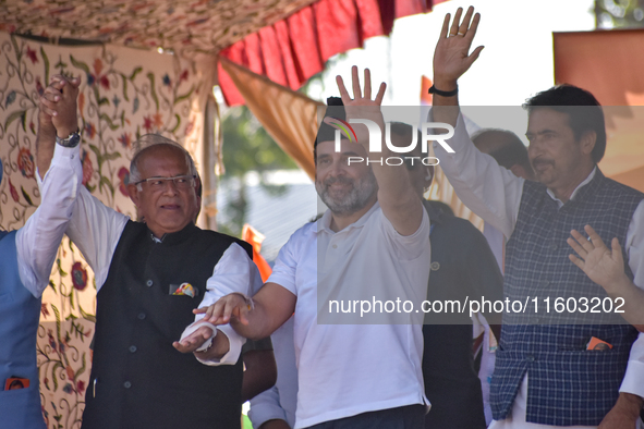 Indian National Congress members stand during a rally held by Rahul Gandhi in Srinagar, Indian Administered Kashmir, on September 23, 2024. 