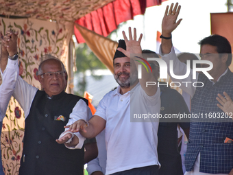 Indian National Congress members stand during a rally held by Rahul Gandhi in Srinagar, Indian Administered Kashmir, on September 23, 2024....