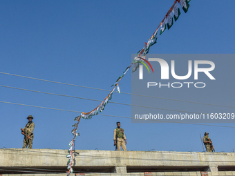 Indian paramilitary troopers stand alert near the venue during an election campaign rally held by Rahul Gandhi in Srinagar, Indian Administe...