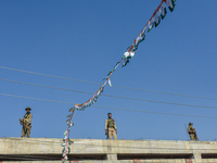 Indian paramilitary troopers stand alert near the venue during an election campaign rally held by Rahul Gandhi in Srinagar, Indian Administe...