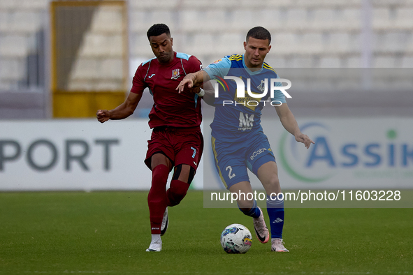 Aldama Thaylor (L) of Gzira United competes for the ball with Jean Borg (R) of Sliema Wanderers during the Malta 360 Sports Premier League s...