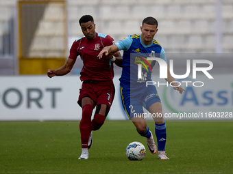 Aldama Thaylor (L) of Gzira United competes for the ball with Jean Borg (R) of Sliema Wanderers during the Malta 360 Sports Premier League s...