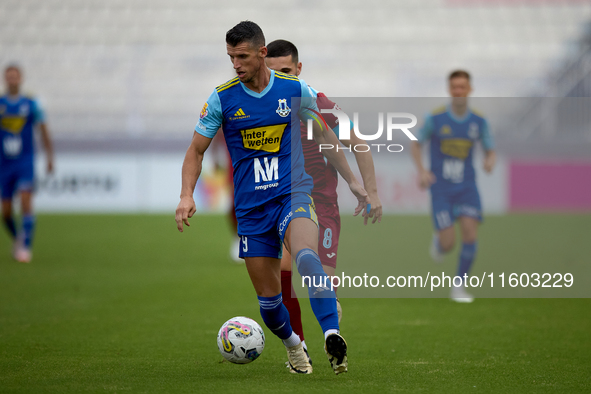 Vito Plut (front) of Sliema Wanderers is in action during the Malta 360 Sports Premier League soccer match between Gzira United and Sliema W...