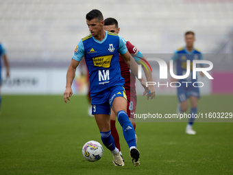 Vito Plut (front) of Sliema Wanderers is in action during the Malta 360 Sports Premier League soccer match between Gzira United and Sliema W...