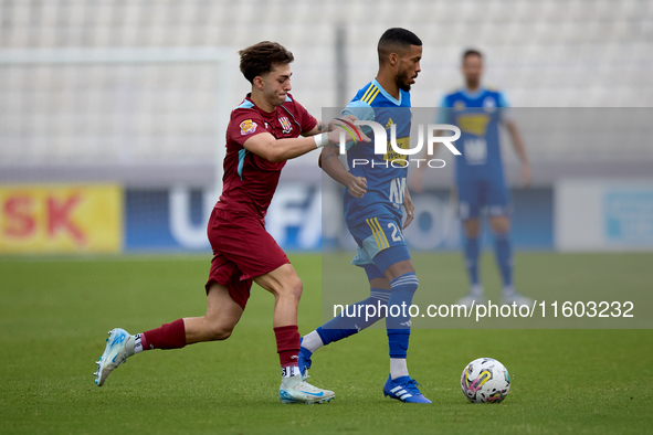 Wescley Matos Da Silva (R) of Sliema Wanderers moves with the ball ahead of Brooklyn Borg (L) of Gzira United during the Malta 360 Sports Pr...