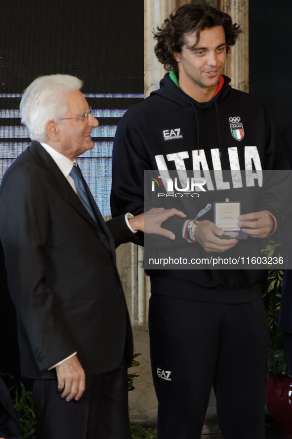 Sergio Mattarella and Thomas Ceccon (R) participate in the return ceremony of the Flag of the Italian athletes returning from the Paris 2024...