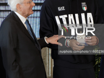 Sergio Mattarella and Thomas Ceccon (R) participate in the return ceremony of the Flag of the Italian athletes returning from the Paris 2024...