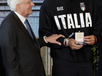 Sergio Mattarella and Thomas Ceccon (R) participate in the return ceremony of the Flag of the Italian athletes returning from the Paris 2024...