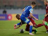 Alex Da Paixao Alves (back) of Gzira United is challenged by Jean Borg (front) of Sliema Wanderers during the Malta 360 Sports Premier Leagu...