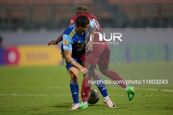 In Ta' Qali, Malta, on September 21, 2024, Alex Da Paixao Alves of Gzira United is challenged by Jean Borg of Sliema Wanderers during the Ma...