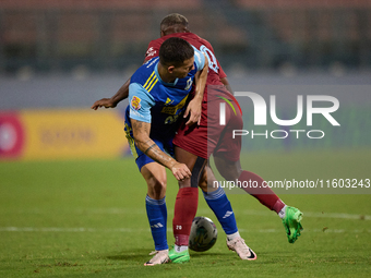 In Ta' Qali, Malta, on September 21, 2024, Alex Da Paixao Alves of Gzira United is challenged by Jean Borg of Sliema Wanderers during the Ma...