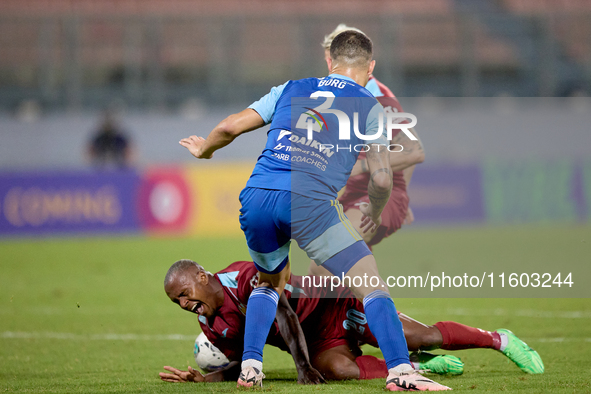 Alex Da Paixao Alves (back) of Gzira United is challenged by Jean Borg (front) of Sliema Wanderers during the Malta 360 Sports Premier Leagu...