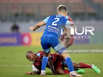 Alex Da Paixao Alves (back) of Gzira United is challenged by Jean Borg (front) of Sliema Wanderers during the Malta 360 Sports Premier Leagu...