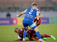 Alex Da Paixao Alves (back) of Gzira United is challenged by Jean Borg (front) of Sliema Wanderers during the Malta 360 Sports Premier Leagu...