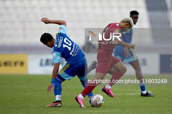 In Ta' Qali, Malta, on September 21, 2024, Samuel Gomes Da Mata (L) of Sliema Wanderers competes for the ball with Marcelo Dias (R) of Gzira...