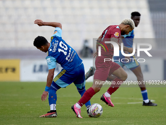 In Ta' Qali, Malta, on September 21, 2024, Samuel Gomes Da Mata (L) of Sliema Wanderers competes for the ball with Marcelo Dias (R) of Gzira...